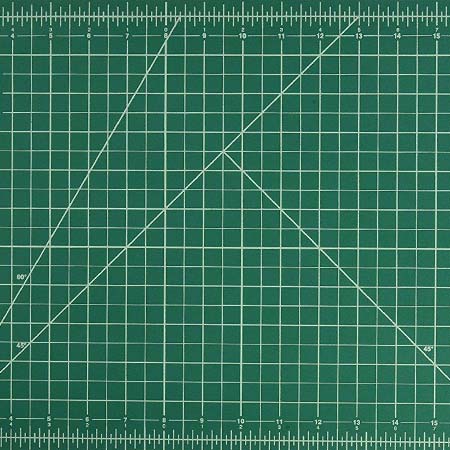 Image of the center section of a green cutting mat covered with a white grid. Three angled lines cut through the grid, denoting different specific angles.